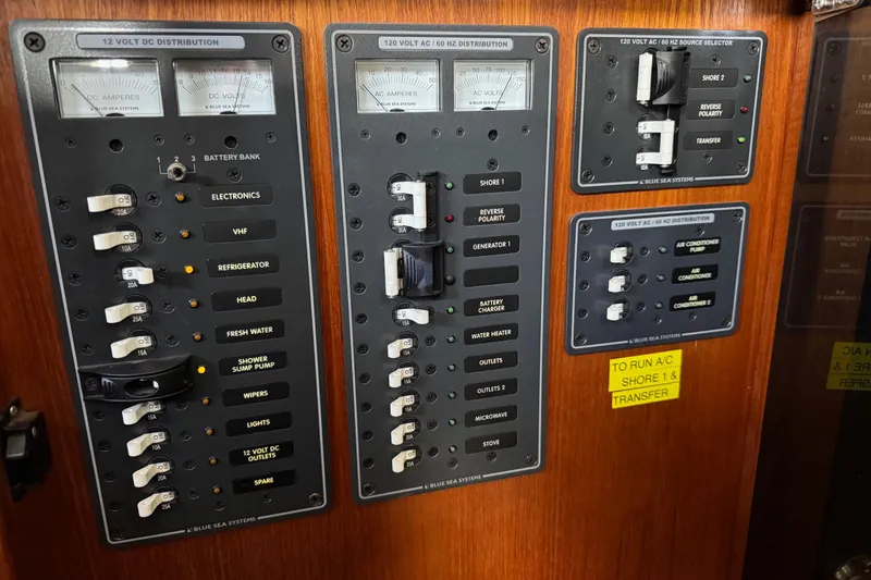 William B Yacht Photos Pics Electrical panel of a 2003 American Tug 34 boat, featuring various switches and meters.