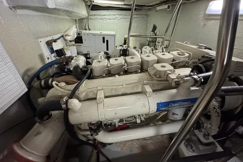 William B Yacht Photos Pics Engine room of a 2003 American Tug 34, featuring a well-maintained marine engine.