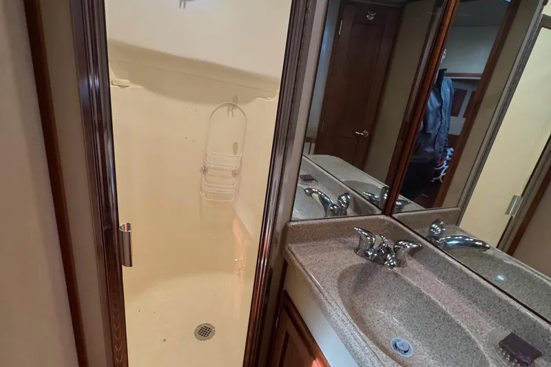 William B Yacht Photos Pics Bathroom interior of 2003 American Tug 34 with shower and mirrored vanity.