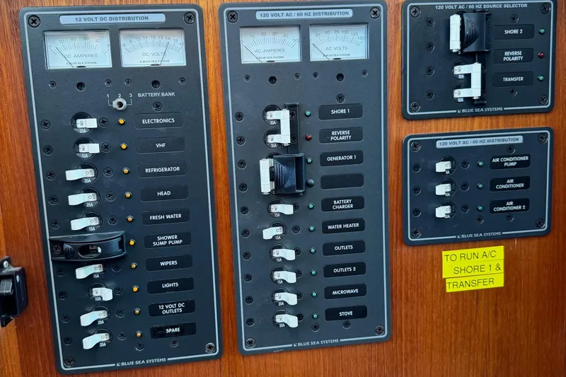 William B Yacht Photos Pics Electrical panel of a 2003 American Tug 34, featuring various circuit breakers and controls.