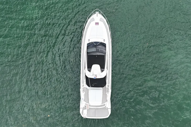 Princessita Yacht Photos Pics Aerial view of 2014 Azimut Atlantis yacht on calm green water.