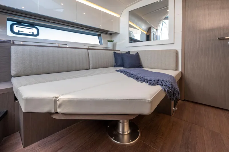 In Stock Yacht Photos Pics 2023 Beneteau Gran Turismo 41 interior with modern seating and elegant decor.