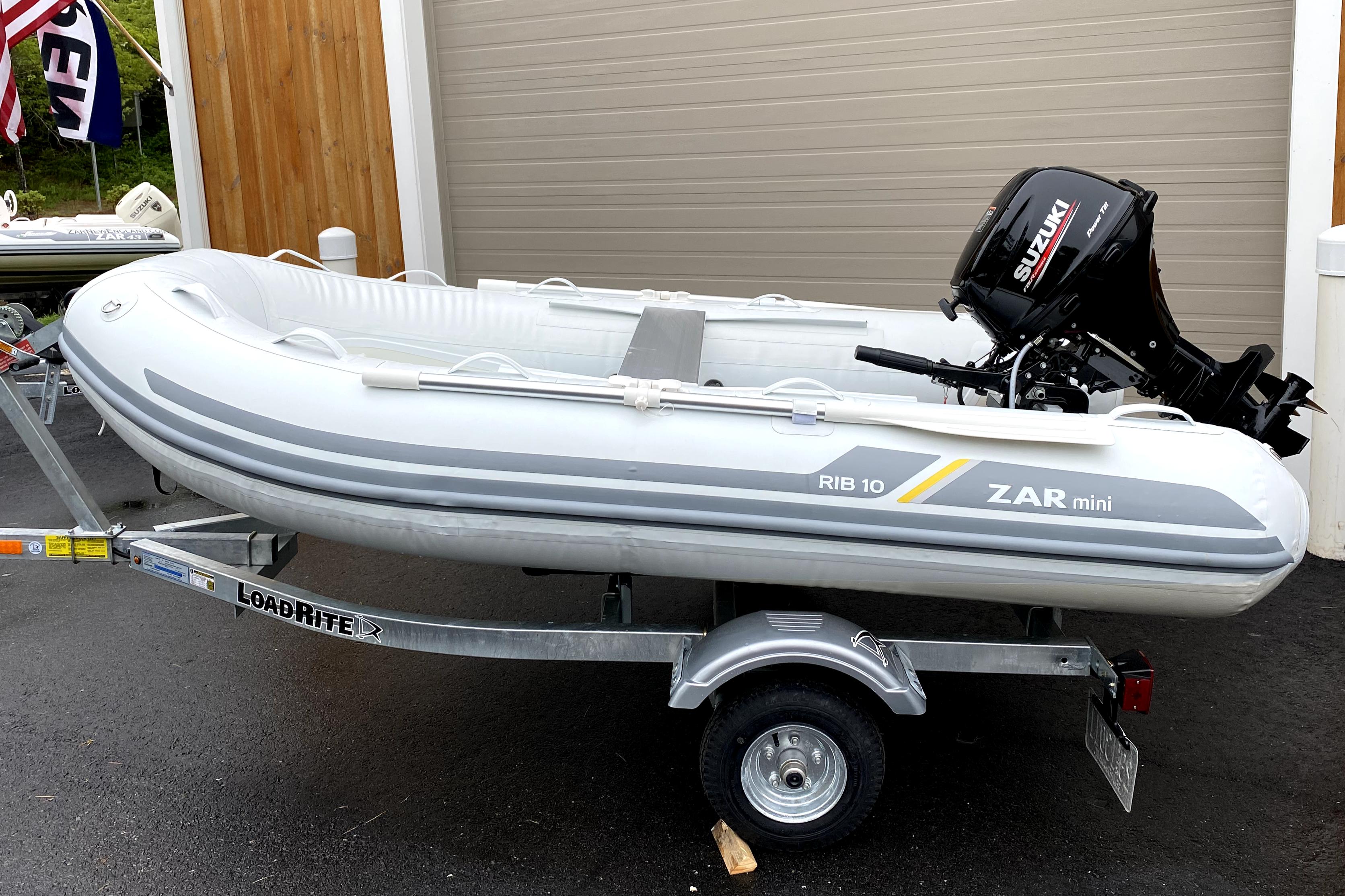 2022 ZAR Mini Rib 10 Lite inflatable boat on trailer with Suzuki outboard motor.