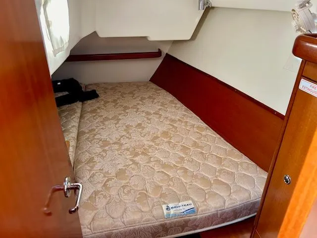 Golden Handcuffs Yacht Photos Pics Cozy cabin interior of 2007 Beneteau 373 sailboat with comfortable mattress.