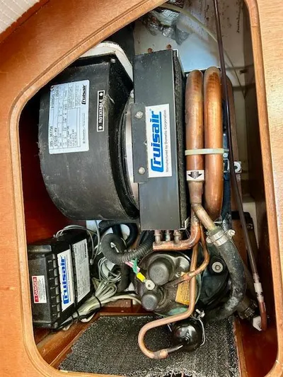 Golden Handcuffs Yacht Photos Pics Cruisair system inside 2007 Beneteau 373 sailboat, showcasing mechanical components.