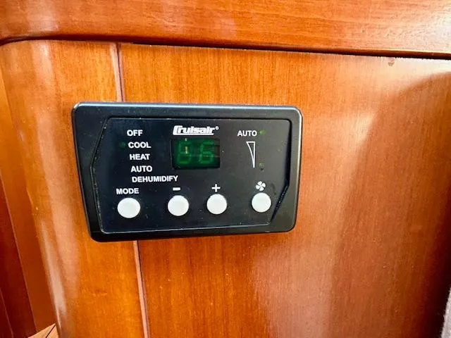 Golden Handcuffs Yacht Photos Pics Control panel on 2007 Beneteau 373 yacht, featuring climate settings.