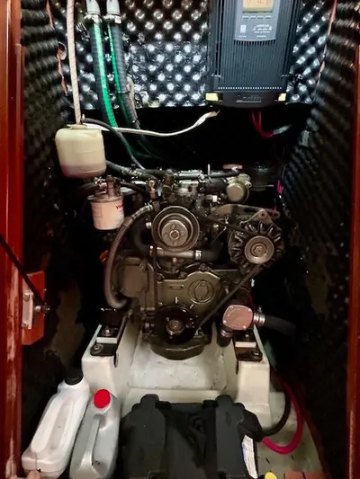 Golden Handcuffs Yacht Photos Pics Engine compartment of a 2007 Beneteau 373 sailboat, featuring mechanical components and wiring.