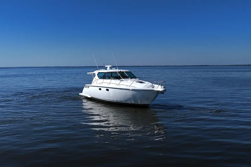 Chico Malo Yacht Photos Pics 2008 Tiara Yachts 4300 Sovran cruising on calm blue waters.