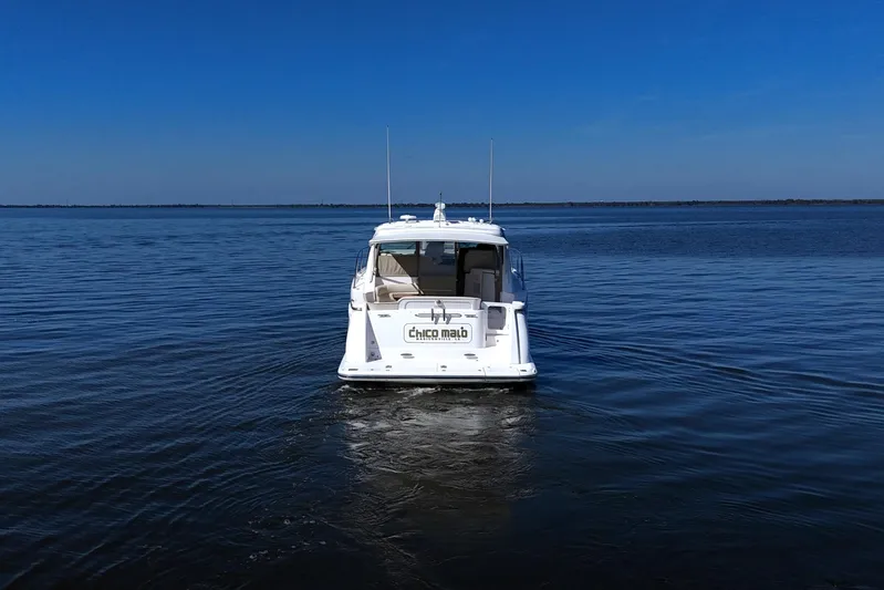 Chico Malo Yacht Photos Pics 2008 Tiara Yachts 4300 Sovran on calm water under clear blue sky.