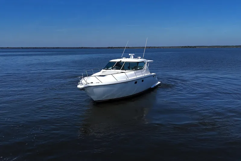 Chico Malo Yacht Photos Pics 2008 Tiara Yachts 4300 Sovran cruising on calm blue waters under clear skies.