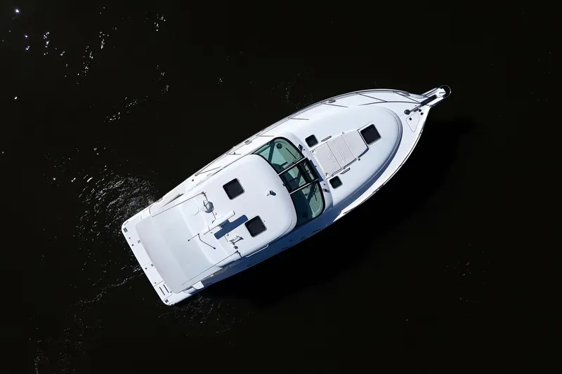 Chico Malo Yacht Photos Pics Aerial view of 2008 Tiara Yachts 4300 Sovran cruising on dark water.