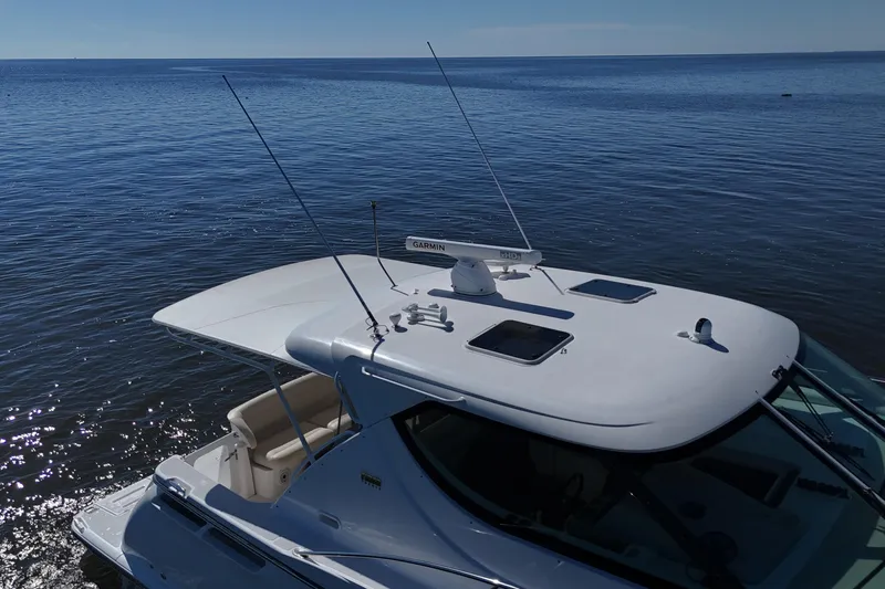 Chico Malo Yacht Photos Pics 2008 Tiara Yachts 4300 Sovran on calm water, showcasing sleek design and advanced features.