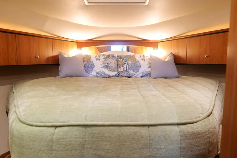 Chico Malo Yacht Photos Pics Luxurious cabin interior of 2008 Tiara Yachts 4300 Sovran with cozy bedding.