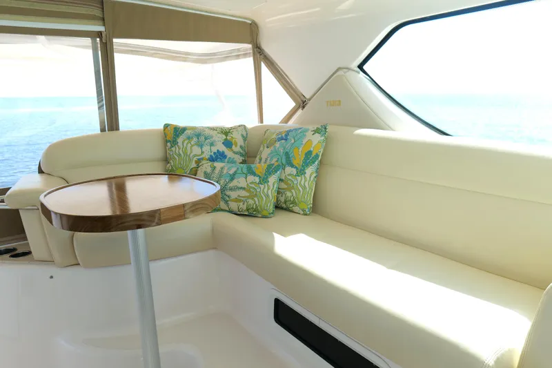 Chico Malo Yacht Photos Pics Luxurious interior of 2008 Tiara Yachts 4300 Sovran with elegant seating and ocean view.