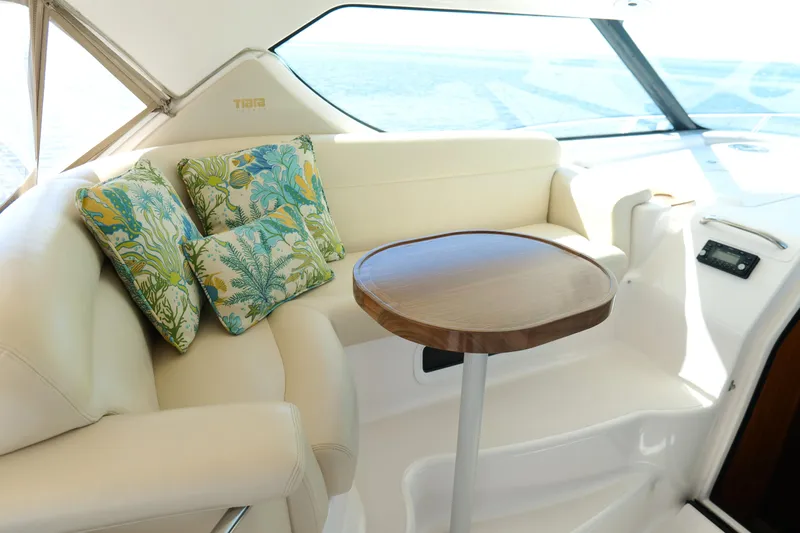 Chico Malo Yacht Photos Pics Luxurious interior of 2008 Tiara Yachts 4300 Sovran with plush seating and decorative pillows.
