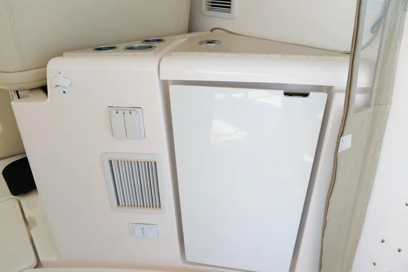 Chico Malo Yacht Photos Pics 2008 Tiara Yachts 4300 Sovran interior with built-in storage and cup holders.