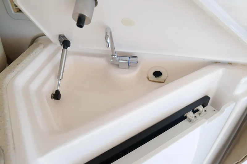 Chico Malo Yacht Photos Pics 2008 Tiara Yachts 4300 Sovran interior compartment with hydraulic support and faucet.