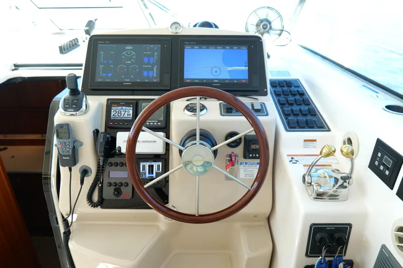 Chico Malo Yacht Photos Pics Helm of 2008 Tiara Yachts 4300 Sovran with navigation screens and controls.