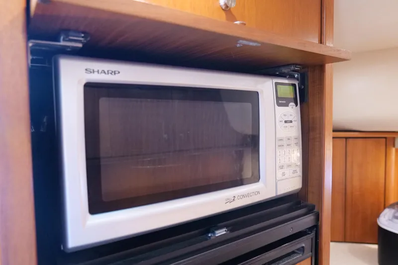 Chico Malo Yacht Photos Pics Sharp microwave in 2008 Tiara Yachts 4300 Sovran kitchen area.