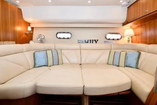 Chico Malo Yacht Photos Pics Luxurious interior of 2008 Tiara Yachts 4300 Sovran with plush seating and elegant decor.