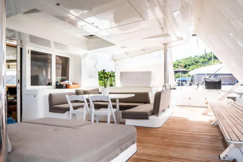  Yacht Photos Pics Spacious deck of 2015 Lagoon 52 F yacht with seating and dining area.