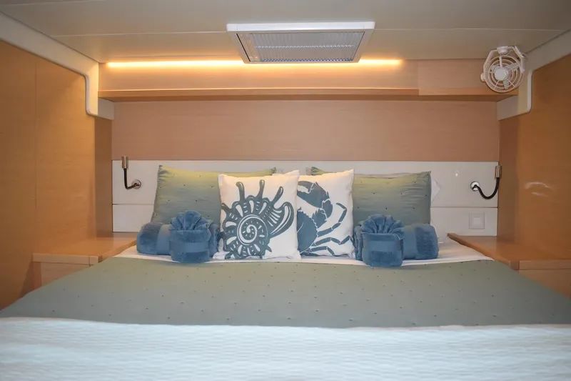  Yacht Photos Pics Luxurious cabin interior of a 2015 Lagoon 52 F yacht with elegant bedding.