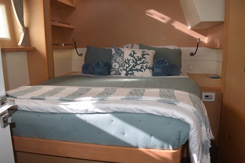  Yacht Photos Pics Luxurious bedroom interior of 2015 Lagoon 52 F yacht with elegant bedding and decor.