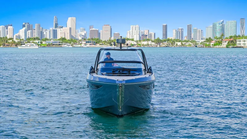 Mischief Yacht Photos Pics Luxury Princess R35 yacht cruising near city skyline, 2021 model.