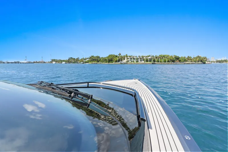 Mischief Yacht Photos Pics 2021 Princess R35 yacht cruising on a sunny day with clear blue skies.