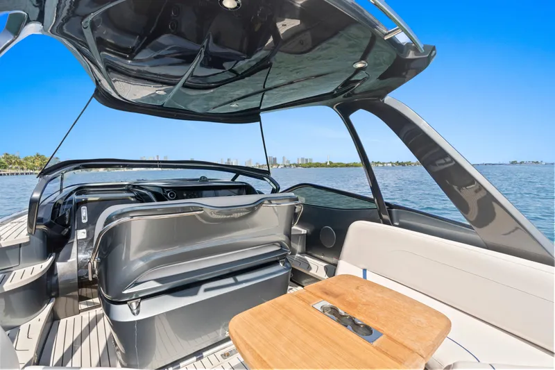 Mischief Yacht Photos Pics Luxury Princess R35 yacht interior with sleek design, open deck, and scenic ocean view.