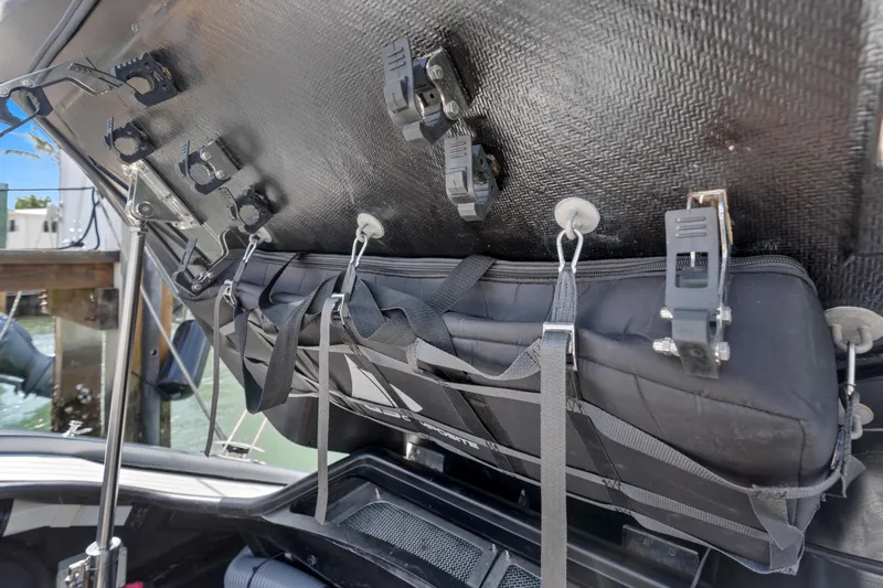 Mischief Yacht Photos Pics Storage compartment on a 2021 Princess R35 boat with secured gear and equipment.