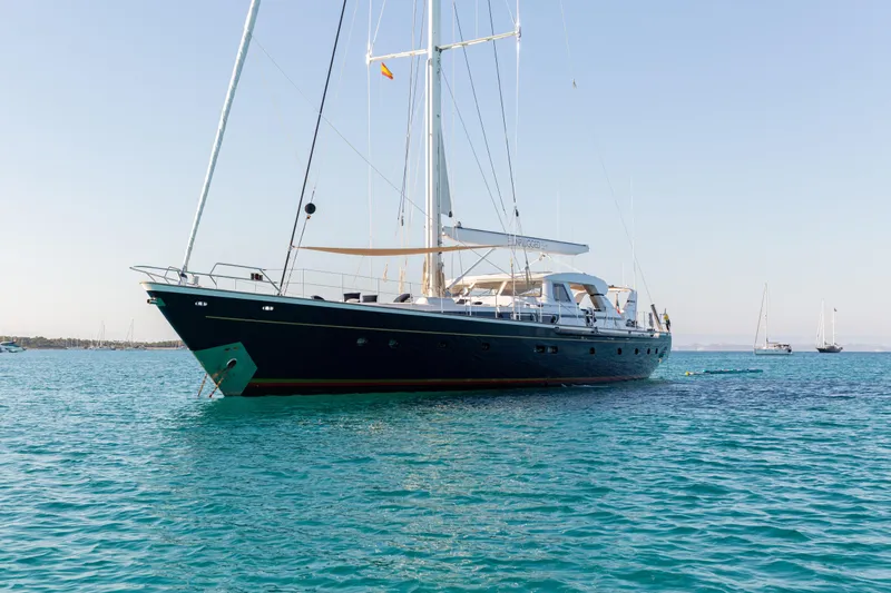 Unplugged Yacht Photos Pics Luxurious 1993 Valdettaro 112 yacht anchored in clear blue waters.