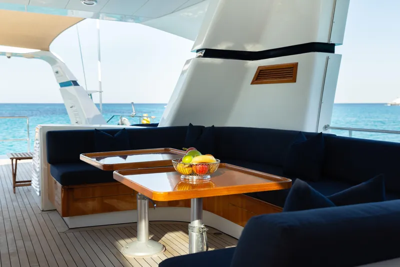 Unplugged Yacht Photos Pics Luxurious 1993 Valdettaro 112 yacht deck with elegant seating and ocean view.