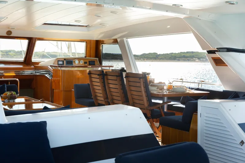 Unplugged Yacht Photos Pics Luxurious 1993 Valdettaro 112 yacht interior with elegant dining area and ocean view.