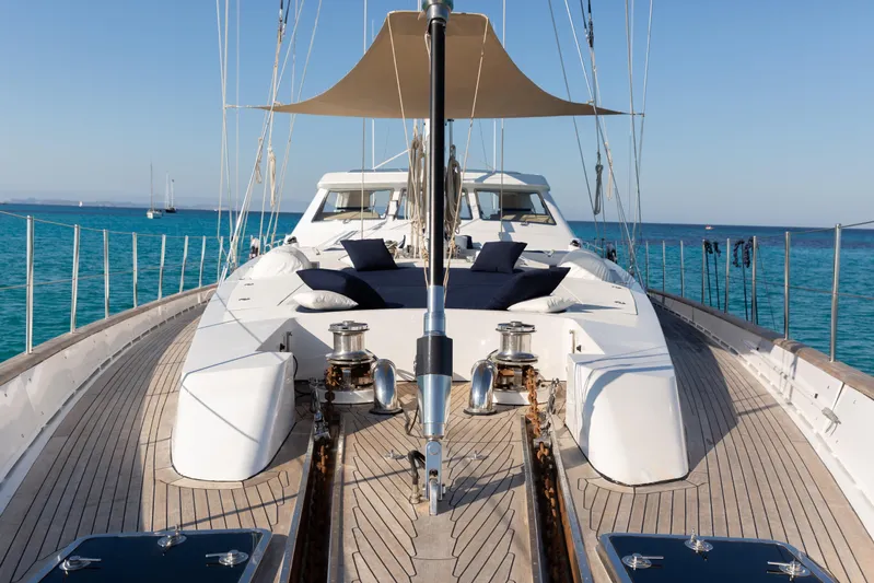 Unplugged Yacht Photos Pics Luxurious 1993 Valdettaro 112 yacht deck with sun loungers and ocean view.