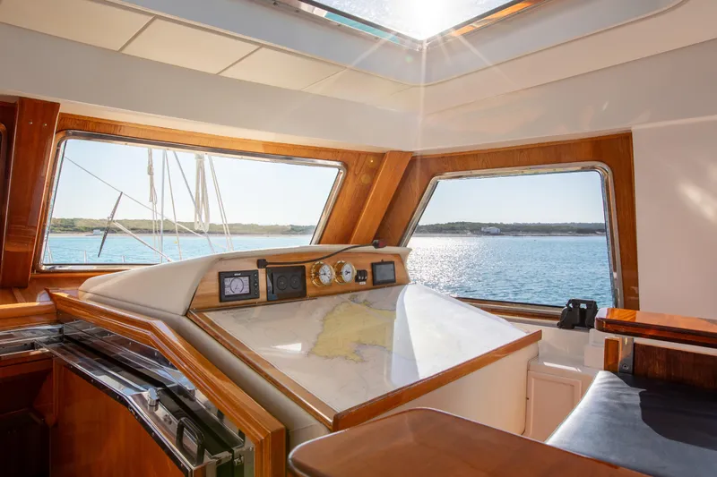 Unplugged Yacht Photos Pics Interior view of 1993 Valdettaro 112 yacht, featuring navigation area and ocean view.