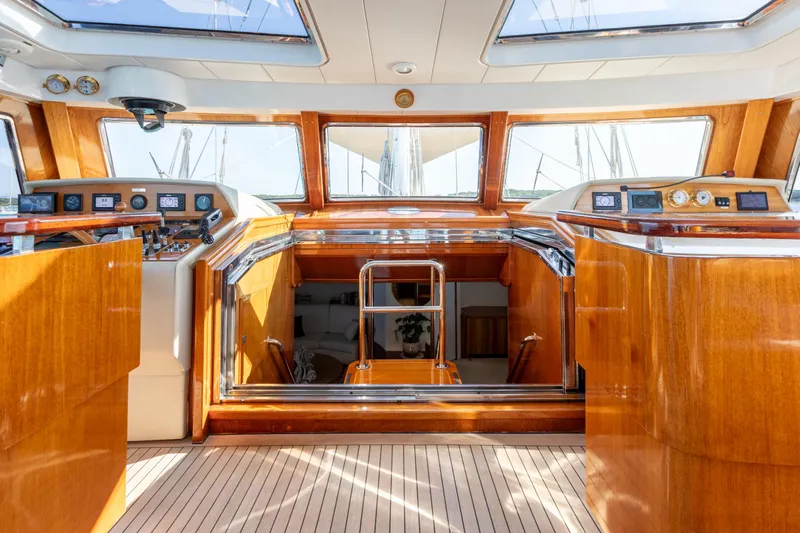 Unplugged Yacht Photos Pics Luxurious interior of 1993 Valdettaro 112 yacht with polished wood and modern controls.