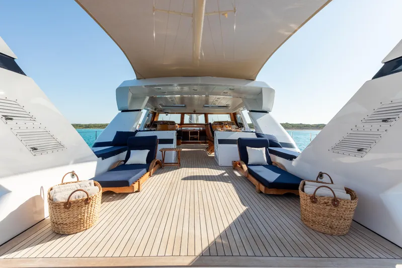 Unplugged Yacht Photos Pics Luxurious 1993 Valdettaro 112 yacht deck with elegant seating and ocean view.