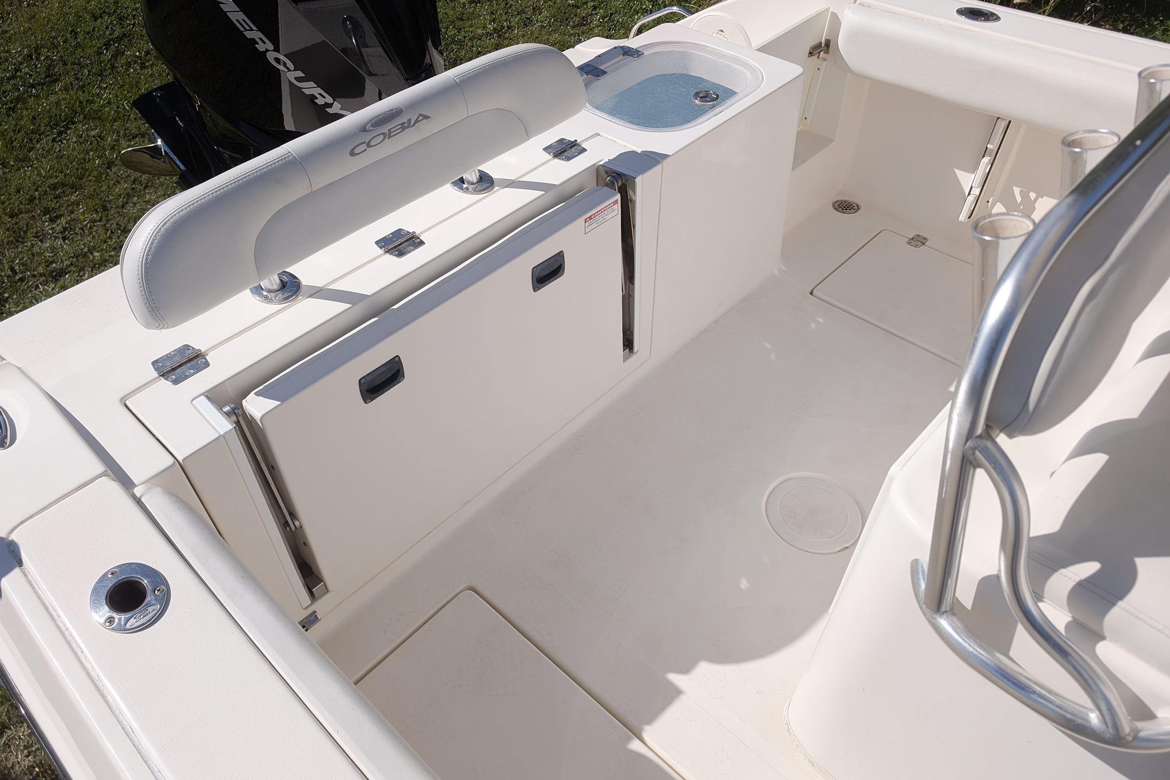 2019 Cobia 237 Center Console boat interior with seating and storage features.