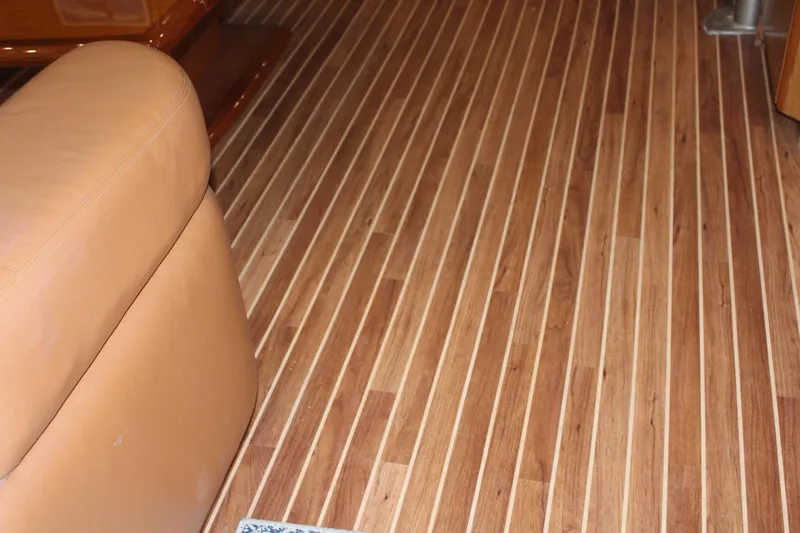 Killin Time Yacht Photos Pics Teak flooring on 2003 Viking 65 Convertible Enclosed Bridge yacht interior.