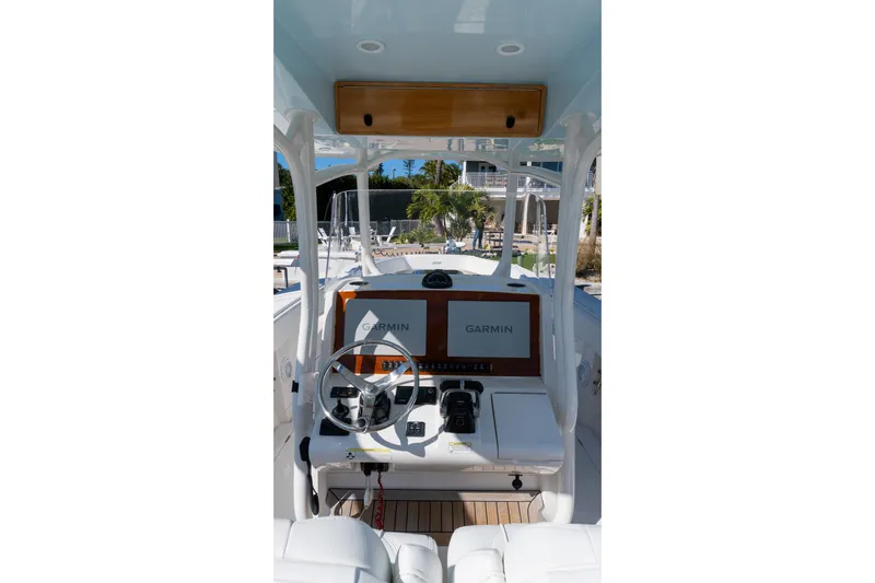  Yacht Photos Pics 2013 Jupiter 34 FS boat helm with Garmin navigation system and steering wheel.