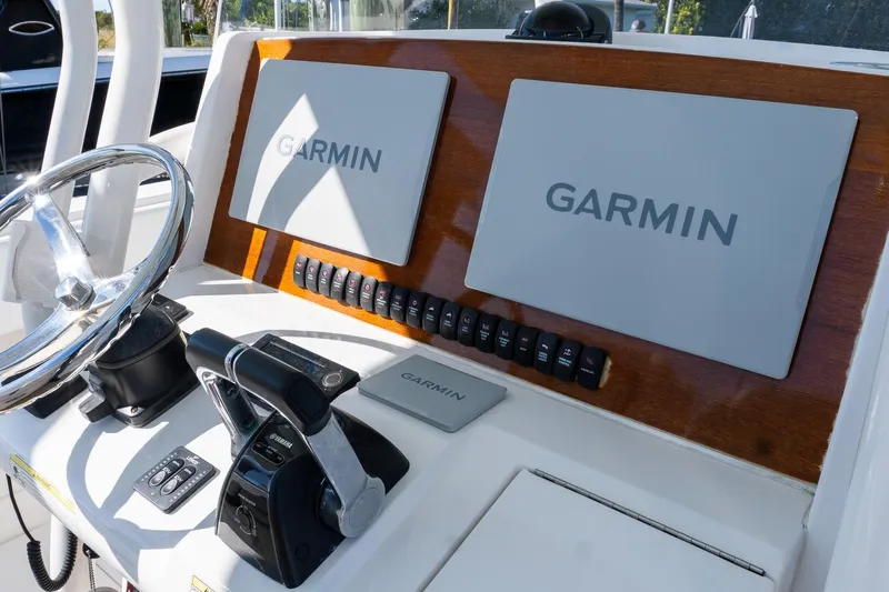  Yacht Photos Pics Control panel of 2013 Jupiter 34 FS boat with Garmin navigation displays.