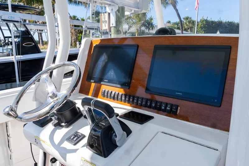  Yacht Photos Pics 2013 Jupiter 34 FS boat dashboard with dual Garmin screens and steering wheel.
