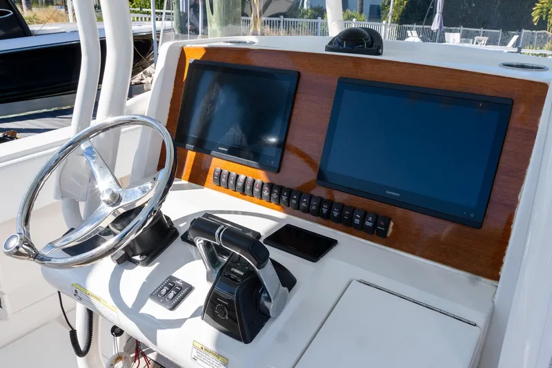  Yacht Photos Pics 2013 Jupiter 34 FS boat dashboard with dual Garmin screens and steering wheel.