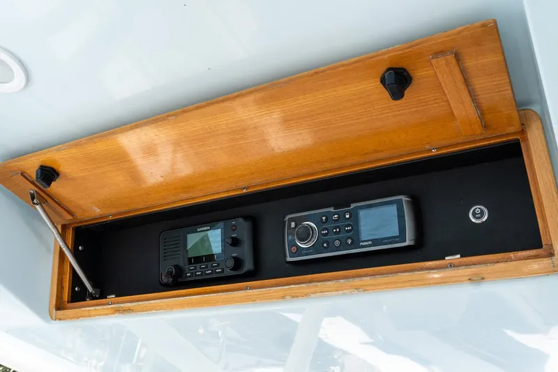  Yacht Photos Pics 2013 Jupiter 34 FS boat electronics panel with Garmin and Fusion devices.