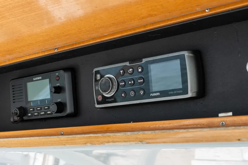 Yacht Photos Pics 2013 Jupiter 34 FS boat dashboard with Garmin and Fusion control panels.