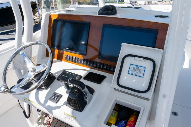  Yacht Photos Pics 2013 Jupiter 34 FS boat dashboard with steering wheel, controls, and navigation screens.