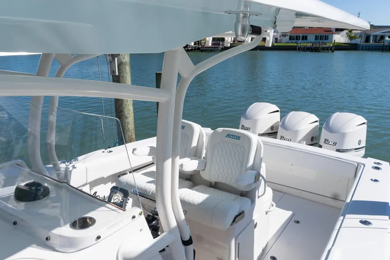  Yacht Photos Pics 2013 Jupiter 34 FS boat with quad engines docked by the water.