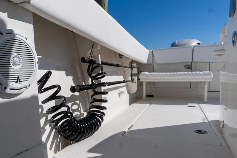  Yacht Photos Pics 2013 Jupiter 34 FS boat interior with speaker and coiled hose on deck.