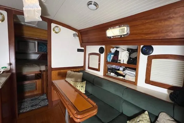 Daisy IV Yacht Photos Pics Interior of 2001 Little Harbor WhisperJet 44 yacht with cozy seating and wooden accents.